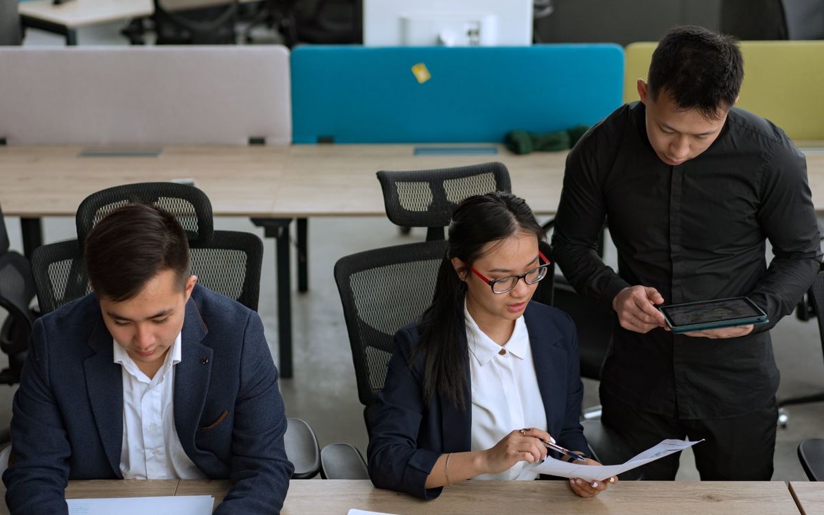 Executives reviewing strategy documents at a desk